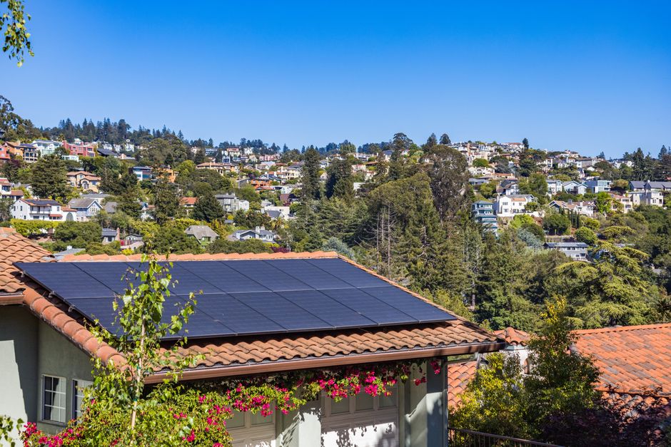 Urban house with flat roof solar installation
